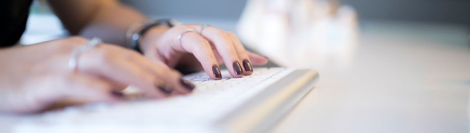  Person typing on a computer